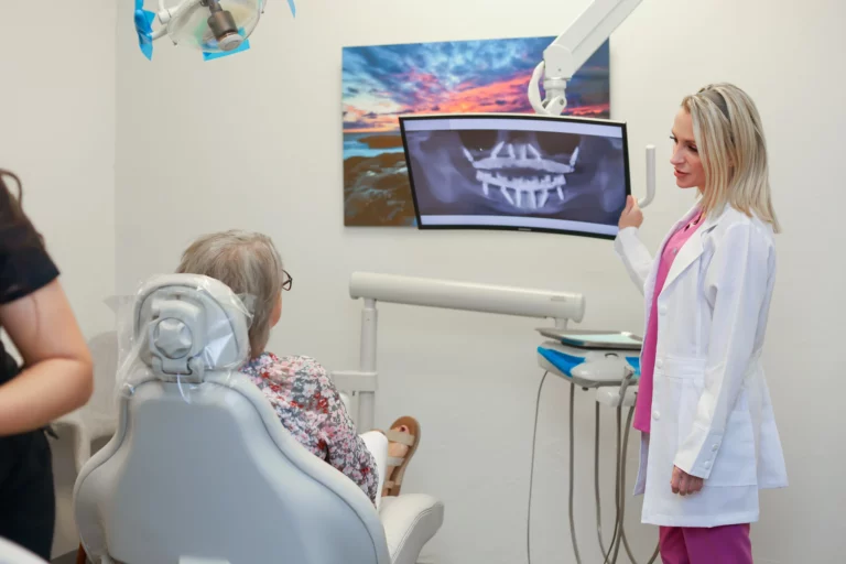 Amarillo dentist discussing dental implant treatment options with a patient.